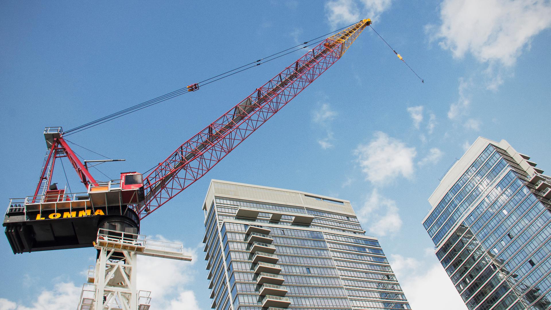 A construction crane rises above a condo development in Brooklyn's Williamsburg neighborhood in 2013.