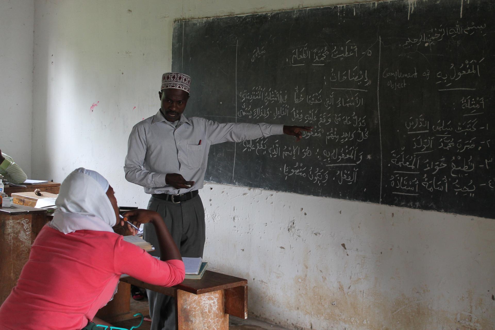 A student of Sumaiya Girls High School being taught Arabic