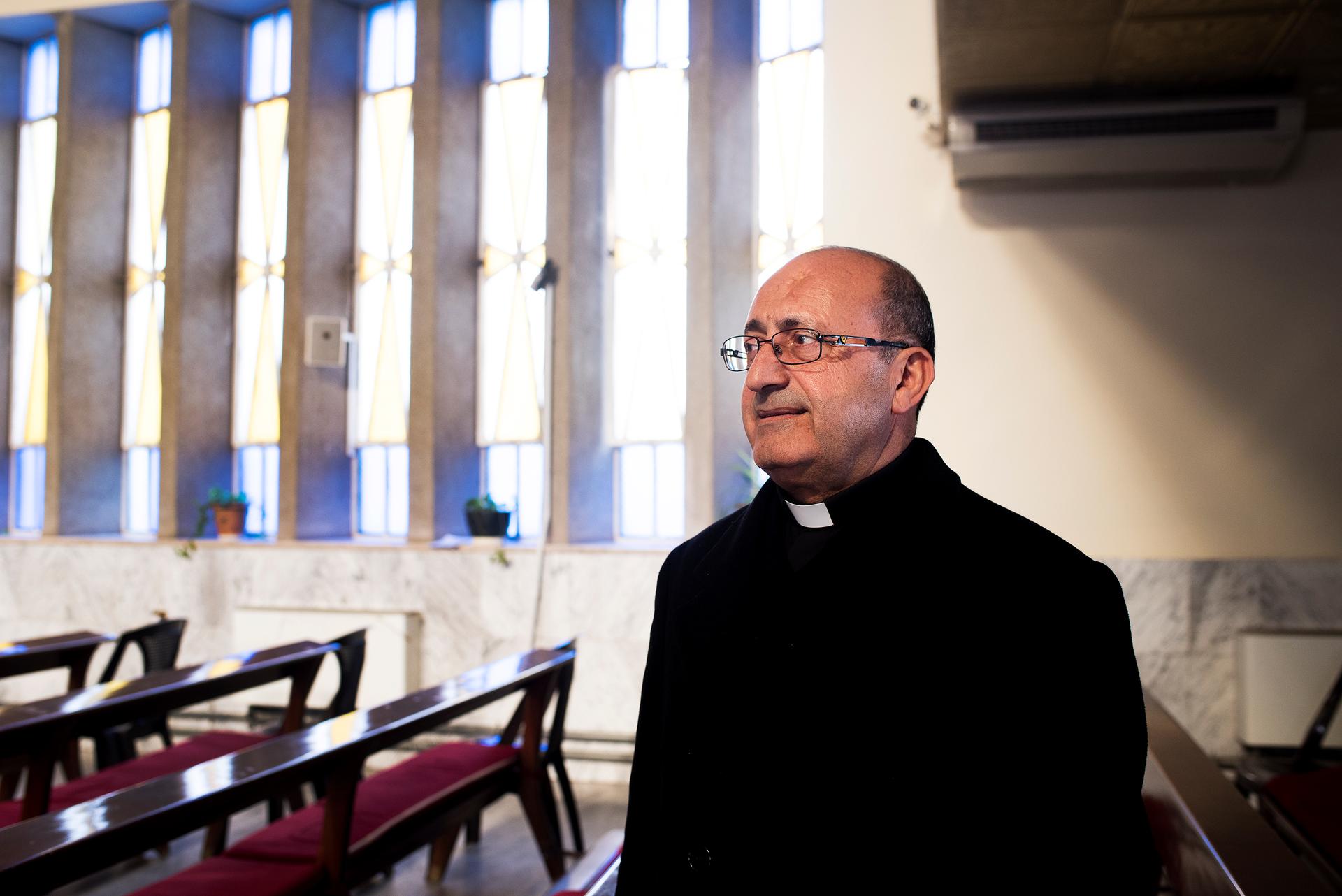Father Khalil Jaar sits in St. Mary's church in Marka, 15 minutes outside of Amman, Jordan.