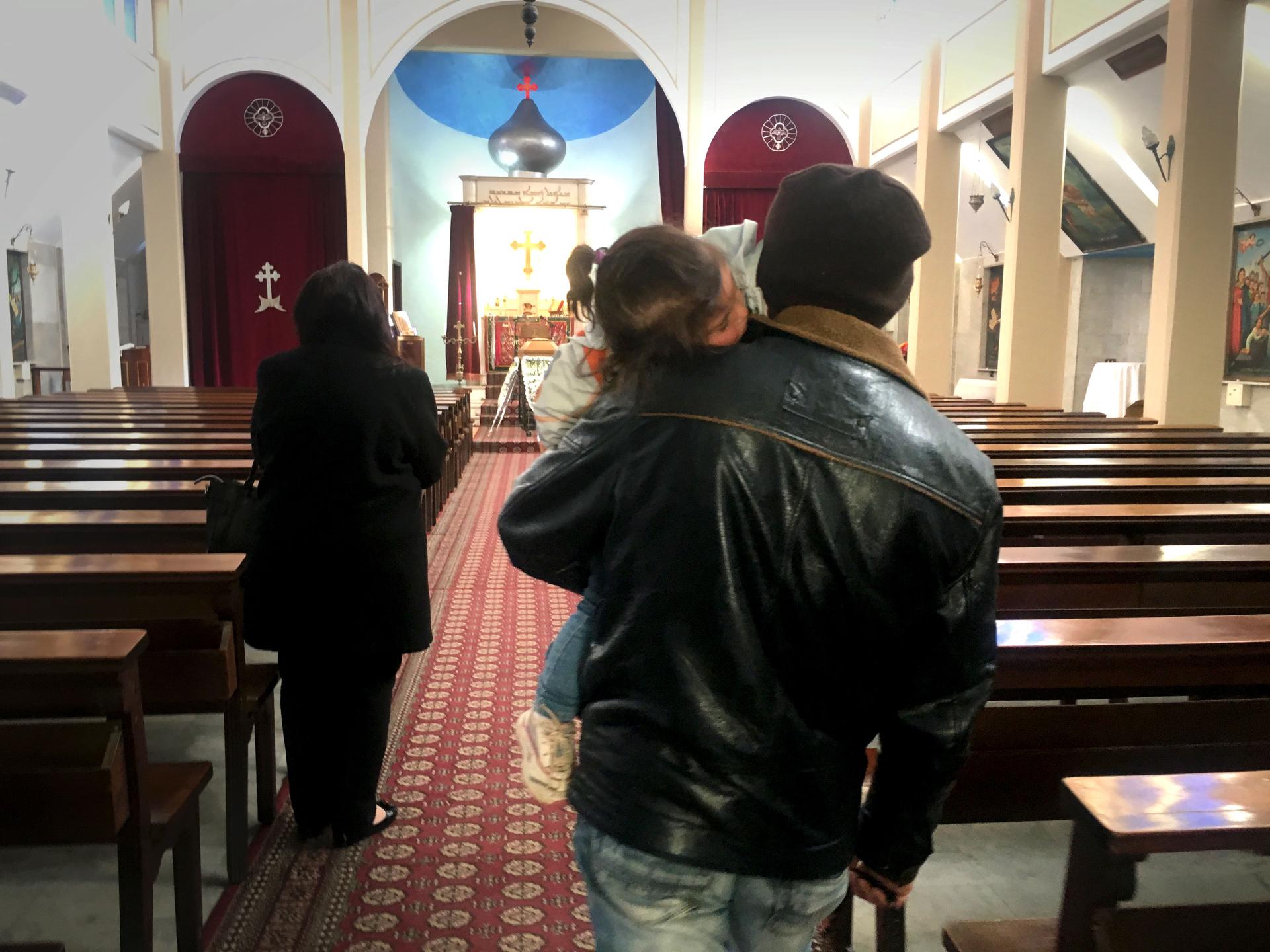 Abu Radwan and his family converted to Christianity after they fled Syria to Lebanon. He says it's a genuine conversion, though he does say he thinks it might help him get resettled in the West.