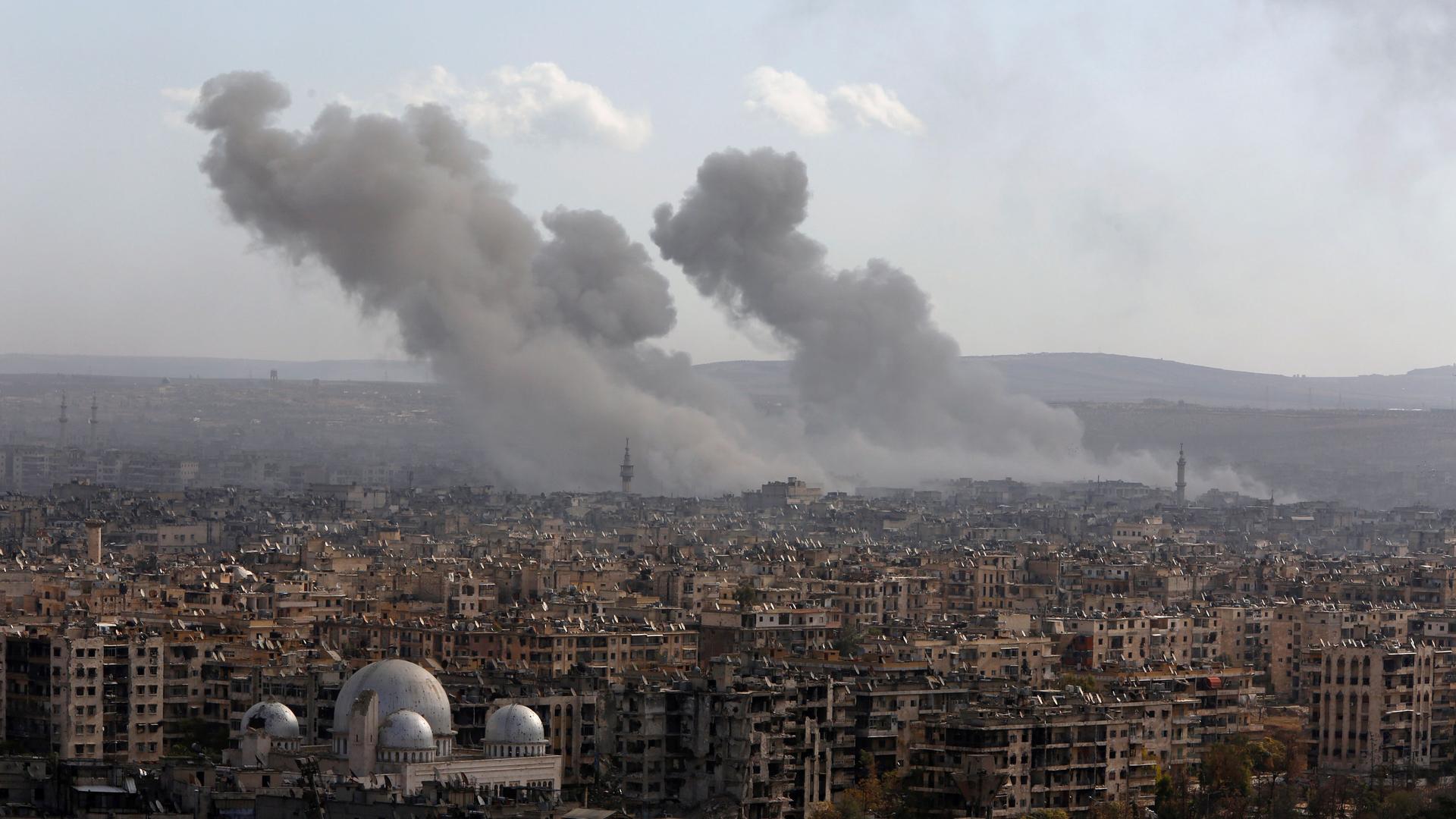 Smoke rises after strikes on Aleppo, Syria, December 3, 2016.