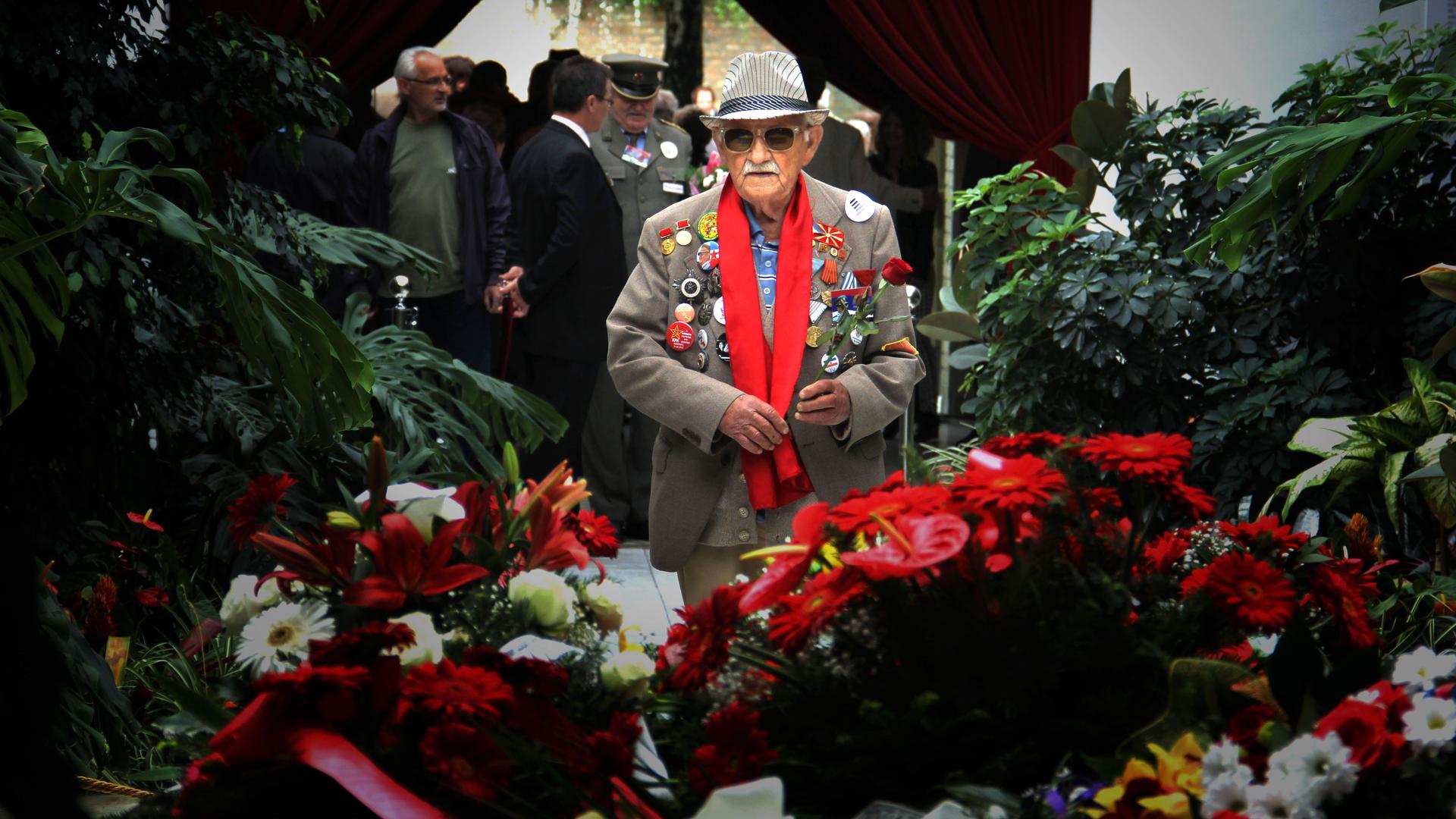 Antonije Nedelkovski, decorated with war medals, fondly recalls his days fighting for Josip Broz Tito in WWII. Here he visits Tito's grave in Belgrade.