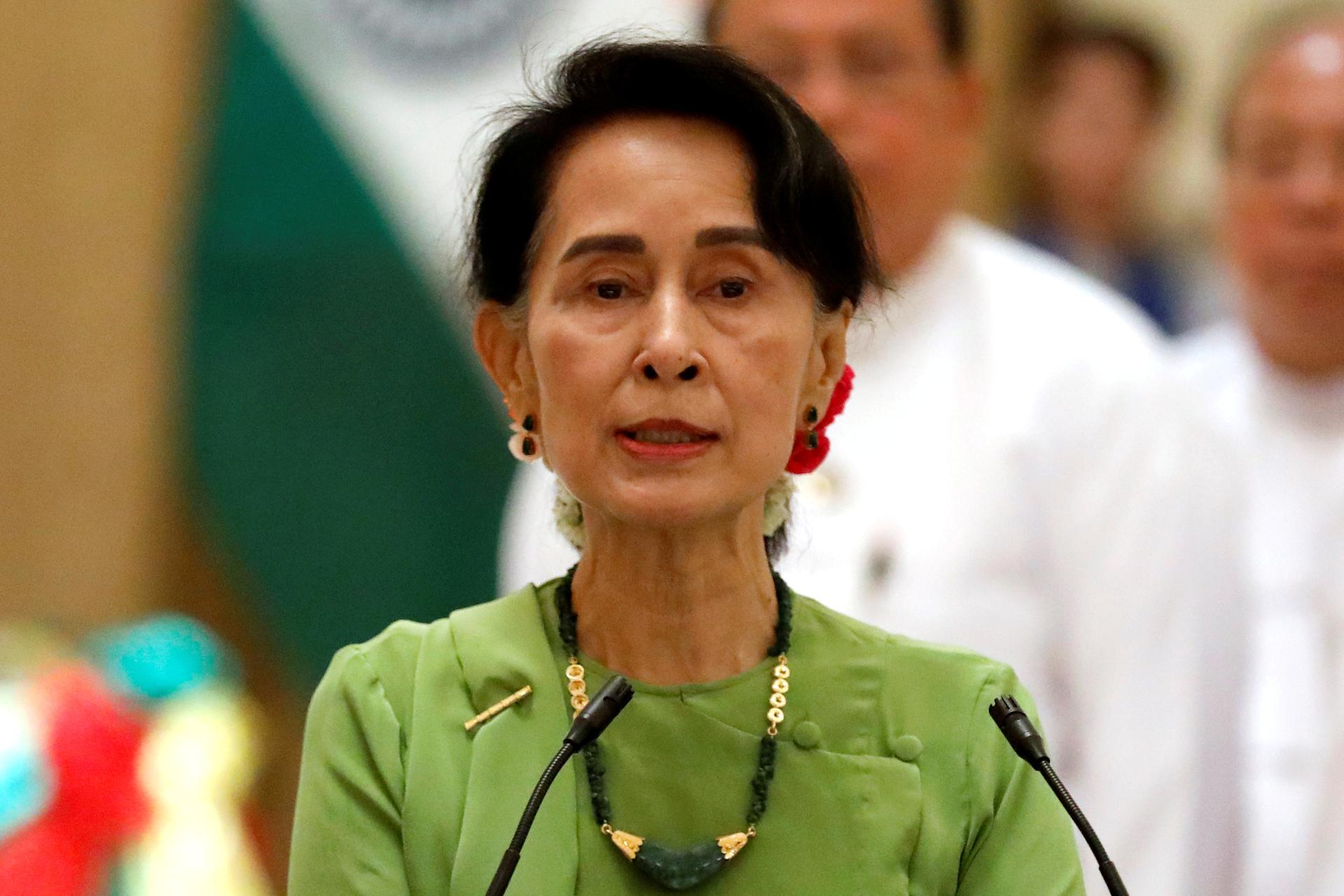 Aung San Suu Kyi speaking at a news conference in Myanmar.