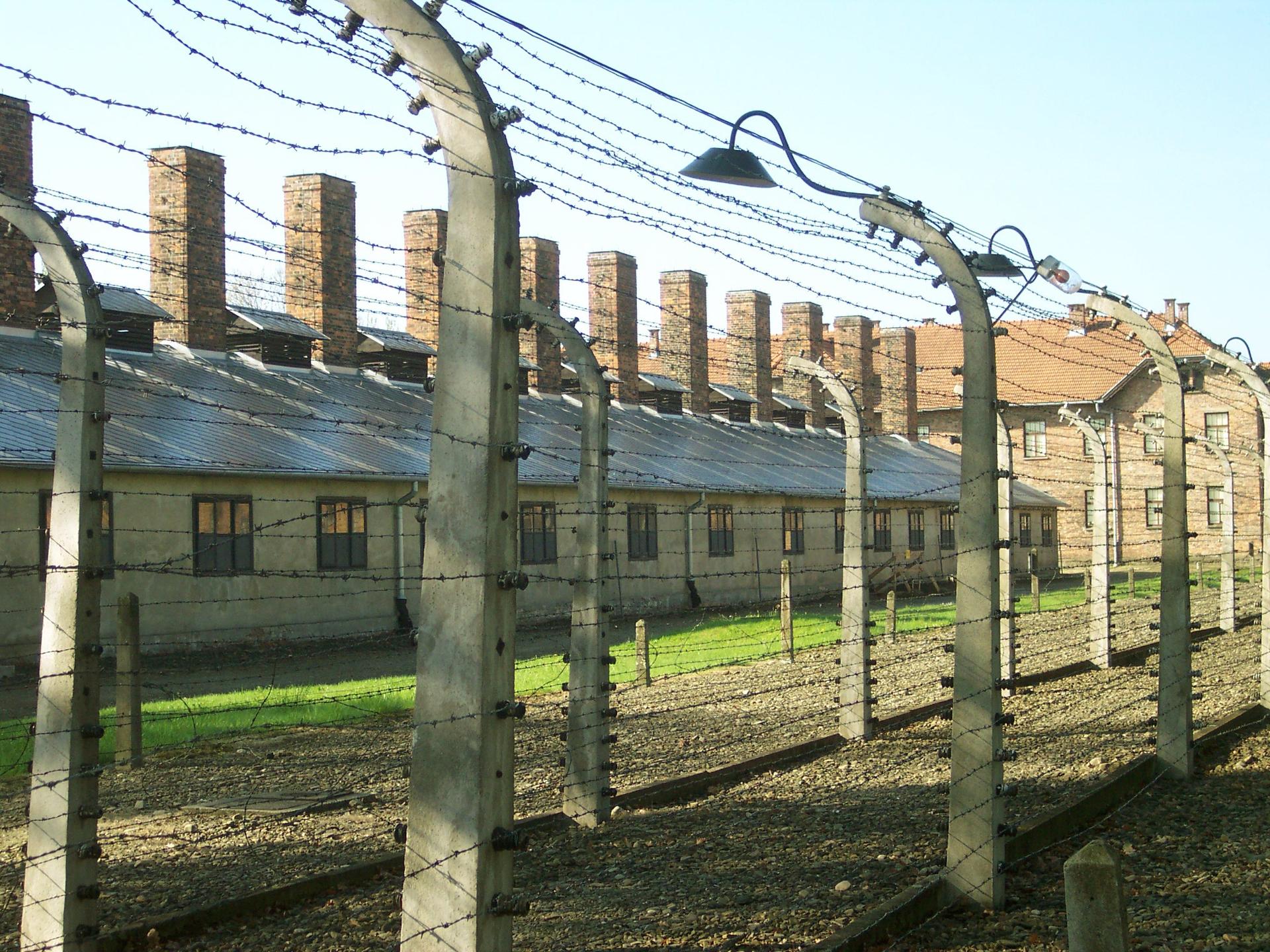 The barbed wire fence surrounding the labor camp at Auschwitz I. Johann Breyer says that he worked here as a guard during World War II and not at the nearby gas chambers at Auschwitz-Birkenau.