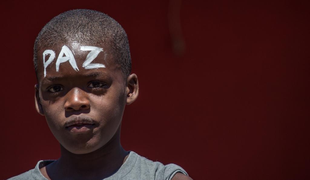 A boy with the Portuguese word for "peace" written on his forehead participated in a peace march in Rio de Janeiro's Alemao favela on April 4.