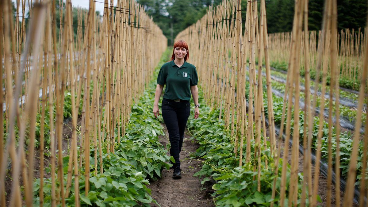 Raluca Cioroianu from Romania poses for a photograph at the farm where she is a shop manager in Addlestone, Britain. "I came here with good intentions, to work, to pay taxes, to improve my knowledge, my culture and to make a better life," said Cioroianu.