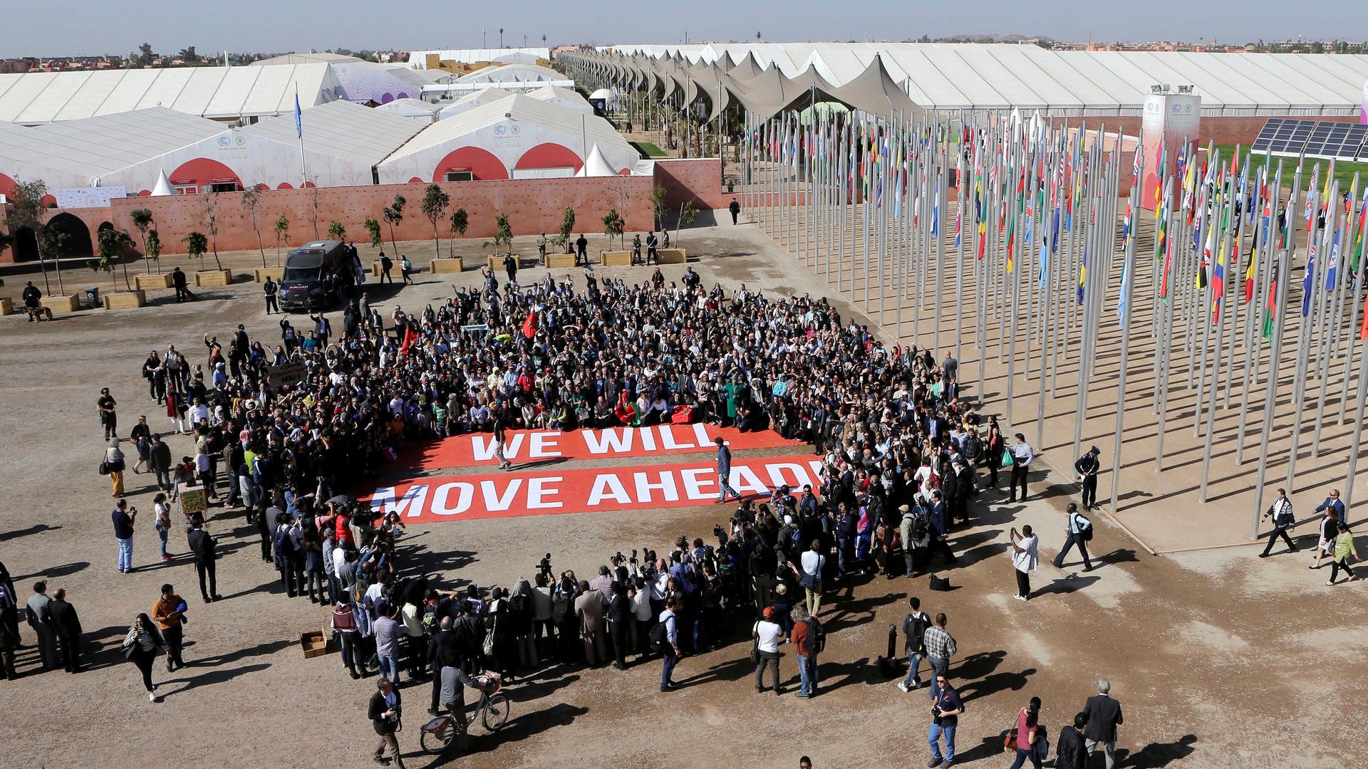 Greenpeace activists stage a protest outside the UN Climate Change Conference in Marrakech, Morocco.