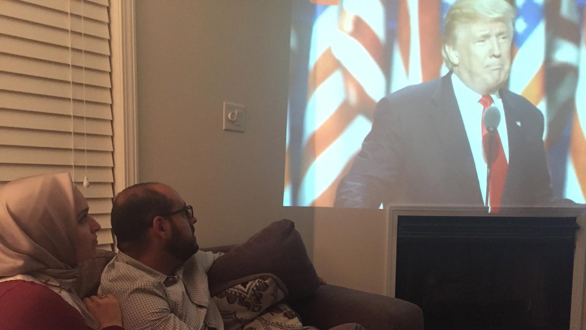 Marwah Maasarani and her husband Omar Awad watching Donald Trump's RNC speech in their New Jersey livingroom on Thursday. 