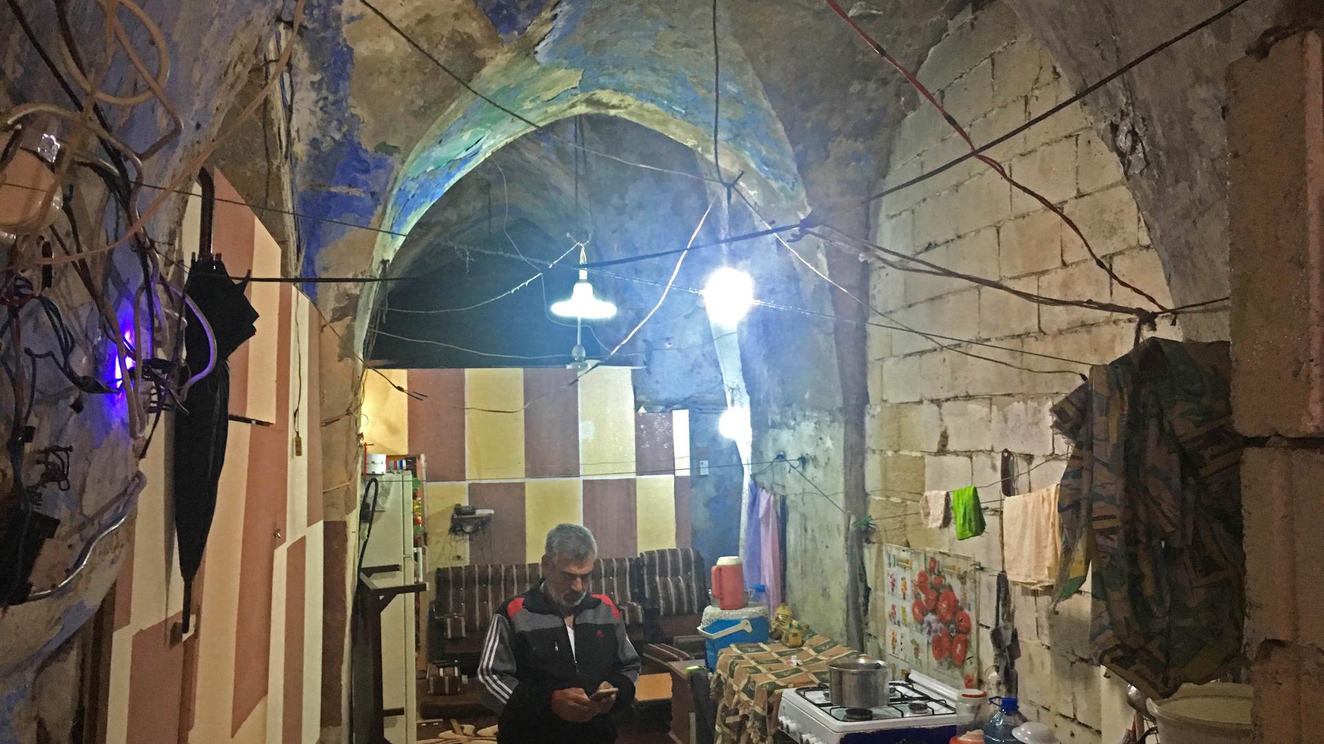 Jihad Al-Mohammed in his home in Saida. When he moved in, the centuries-old building was abandoned, but it used to be a Jewish synagogue. 