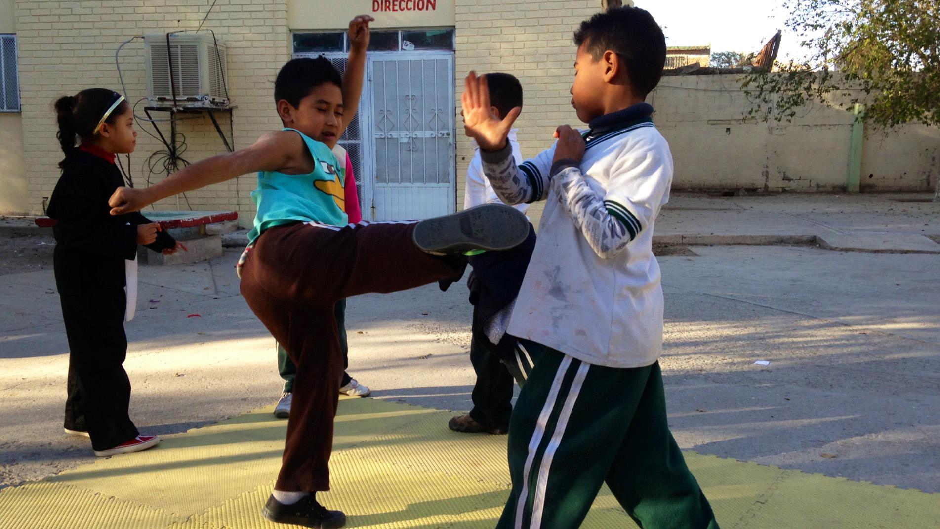 Children practice tae kwon do at an after school program in Cuidad Juárez, funded by the Merida Initiative.