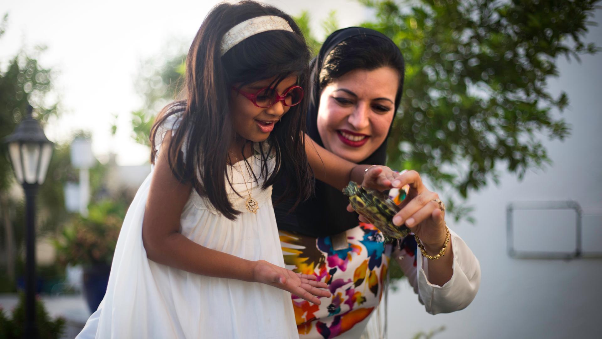 Ayesha Albusmait, and her daughter, Reem Abdullah Rashid. Albusmait is one of the small, but growing number of single Emirati woman choosing to adopt.