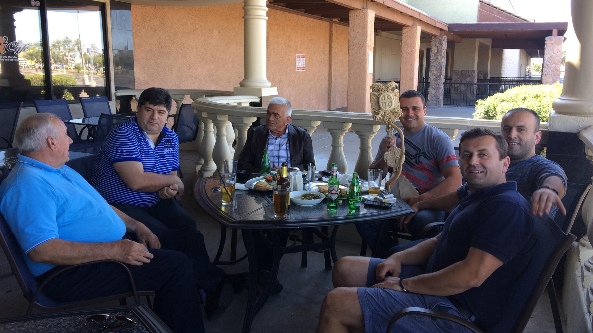 A group of Serbian-speaking men have a leisurely lunch at the Q2 Café in Phoenix. The café, run by a Bosnian Serb refugee, aims to attract patrons from all parts of the former Yugoslavia.