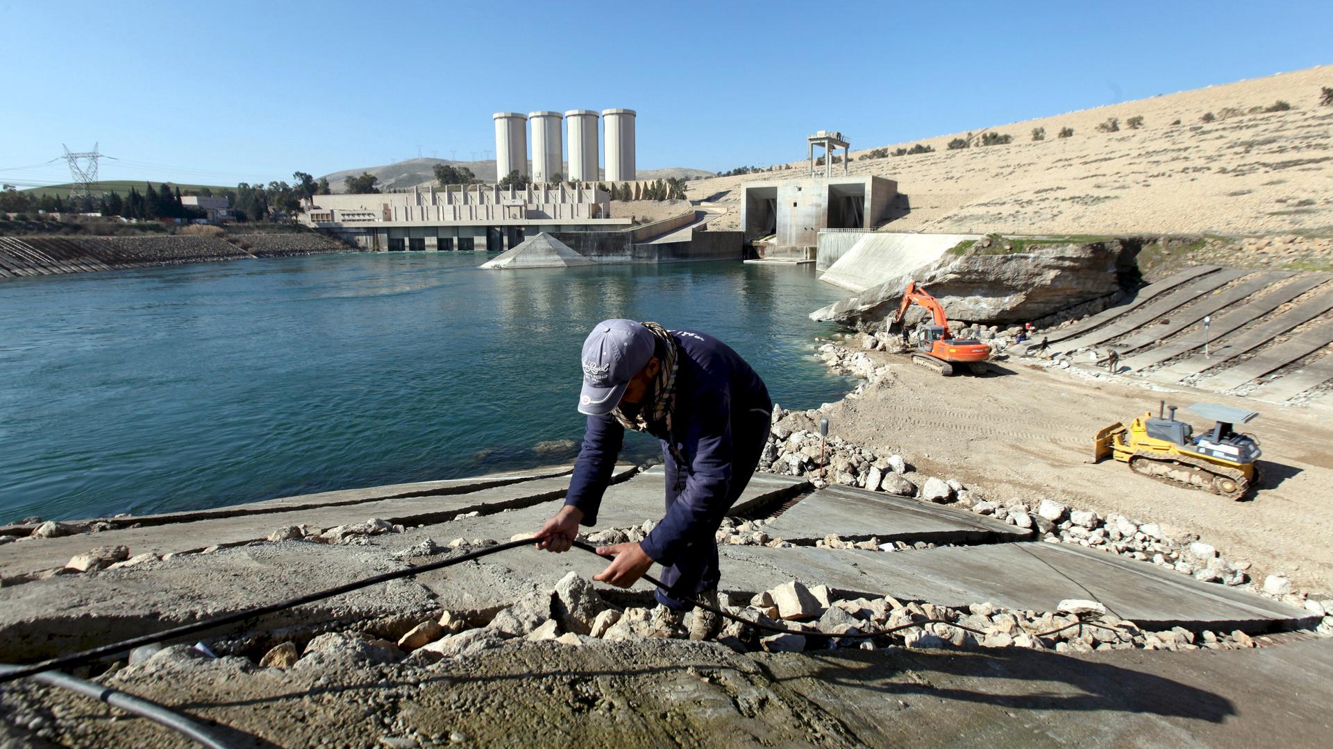 An employee works at strengthening the Mosul Dam in northern Iraq, in February 2016. 