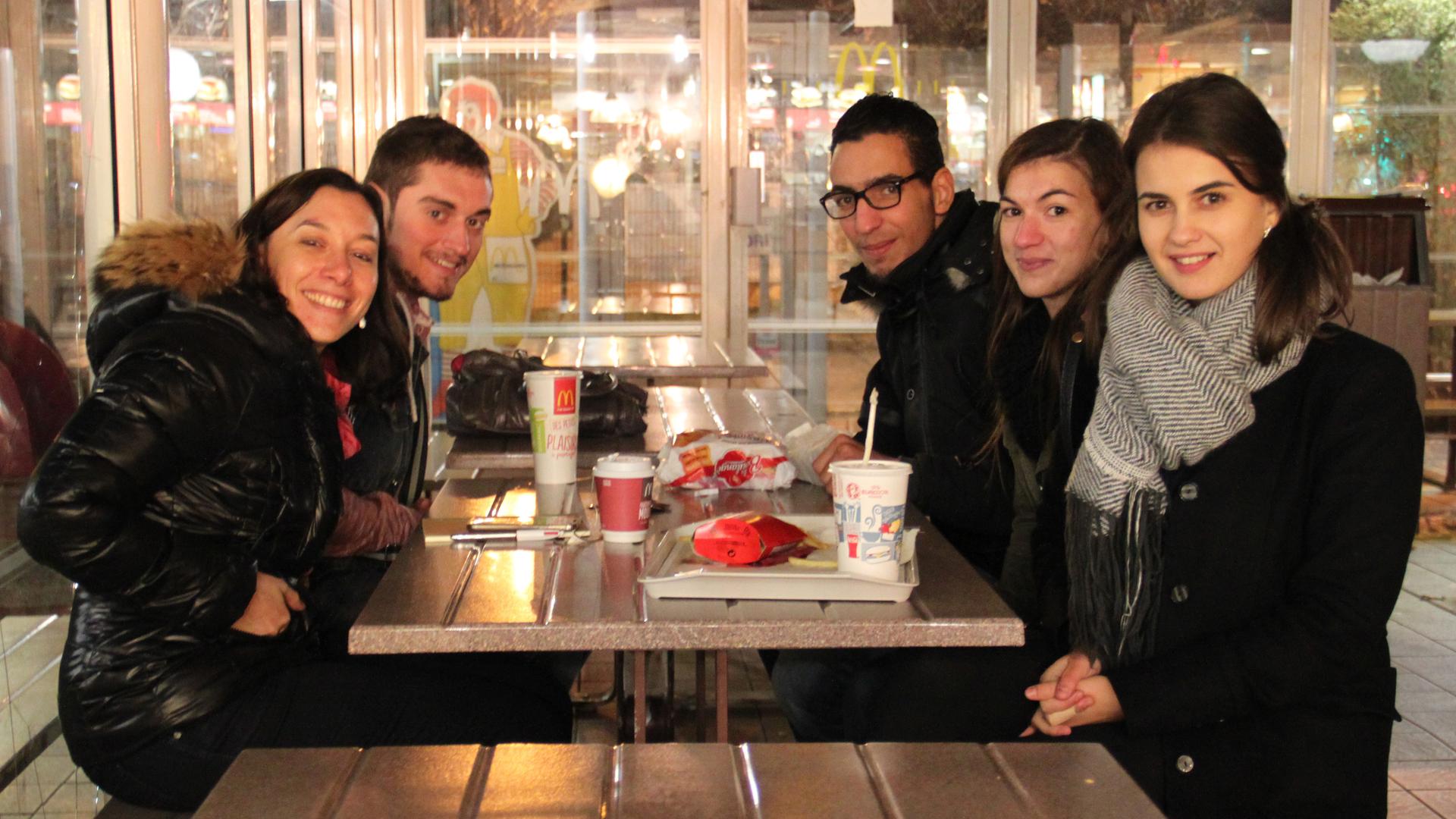 McDonalds is one of the few places open on a Sunday night in the Paris suburb of Épinay-sur-Seine. (Clockwise from left: Angeline Rochery and former students, Steven dos Santos, Samir Saïfi, Laeticia Rodrigues, Cristina Riscou)
