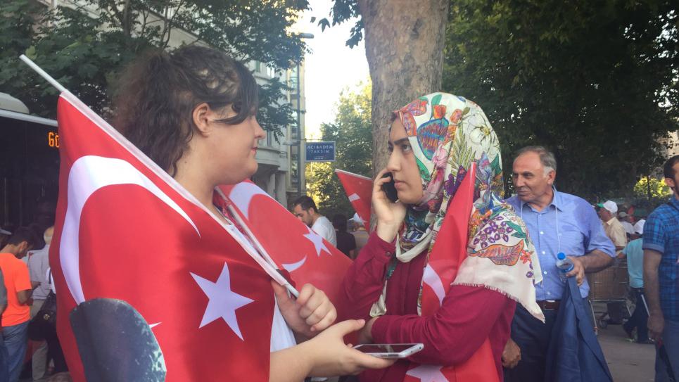 Two women discuss Turkish politics during a joint rally in Istanbul between the Islamist and secularist parties shortly after the attempted coup in late July. 