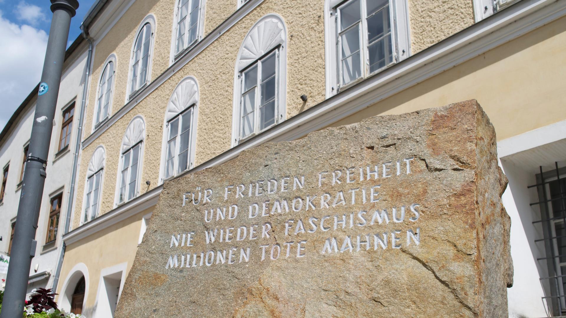 Outside the house in Austria where Adolf Hitler was born there's a block of stone from the Mauthausen concentration camp. It reads "for peace freedom and democracy, never again fascism, remember the millions of dead."