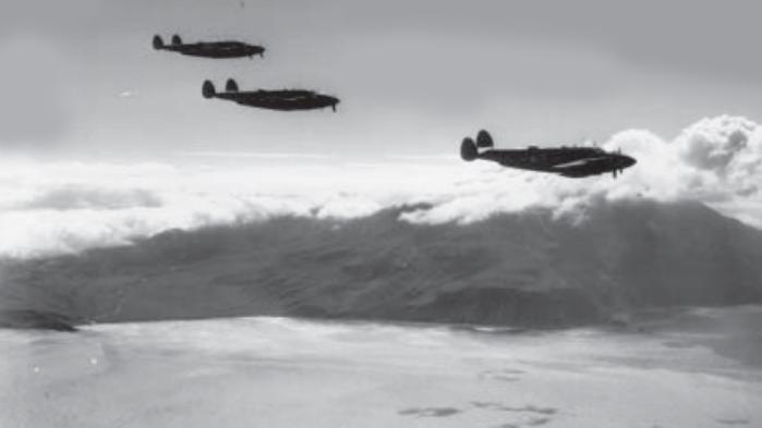 Three PV-1 planes fly by Kiska Volcano during the Allied invasion of Kiska on August 15, 1943.