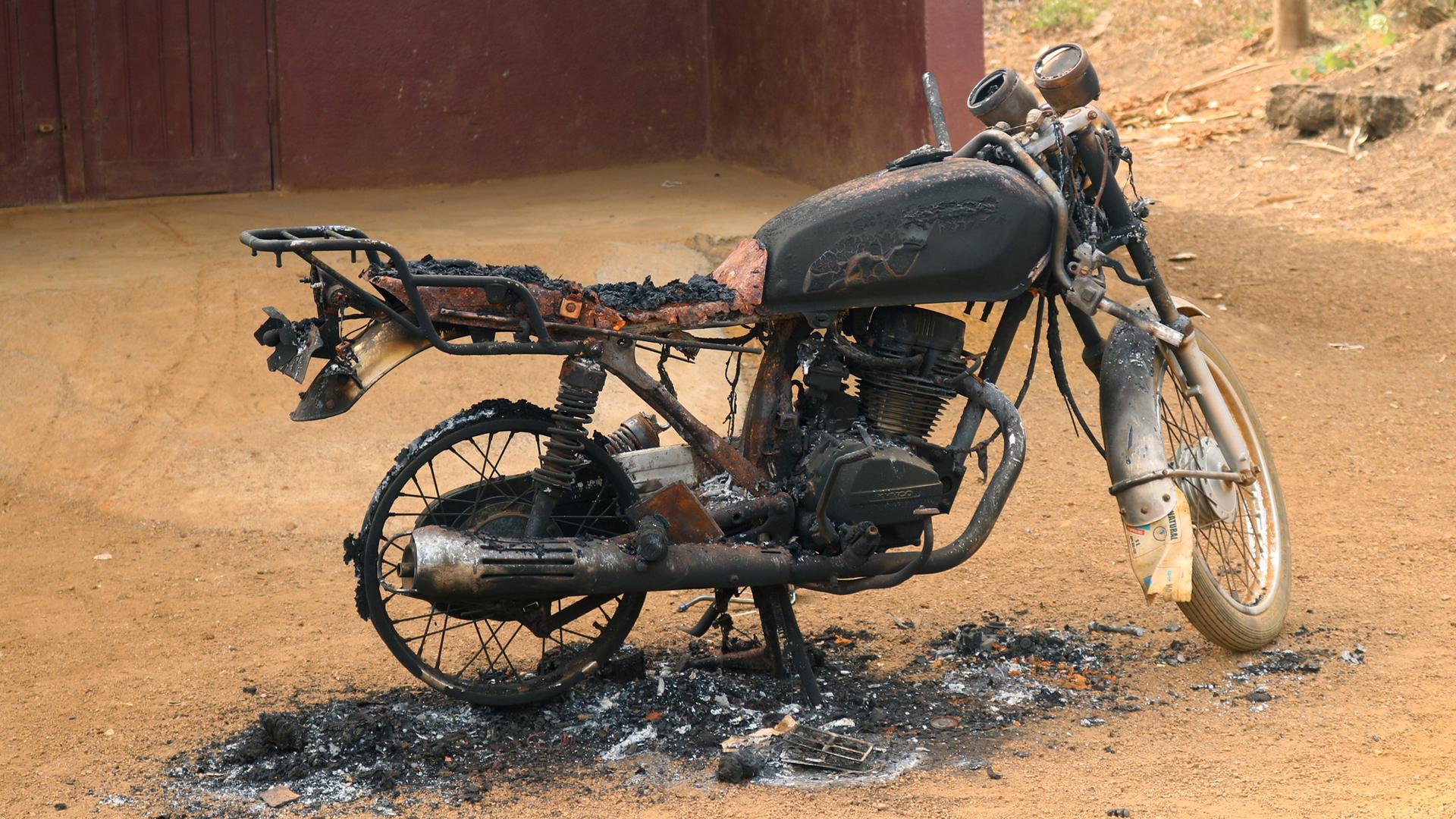 A burned and destroyed motorcycle is seen in Kembong, south-west region of Cameroon Dec. 29, 2017.