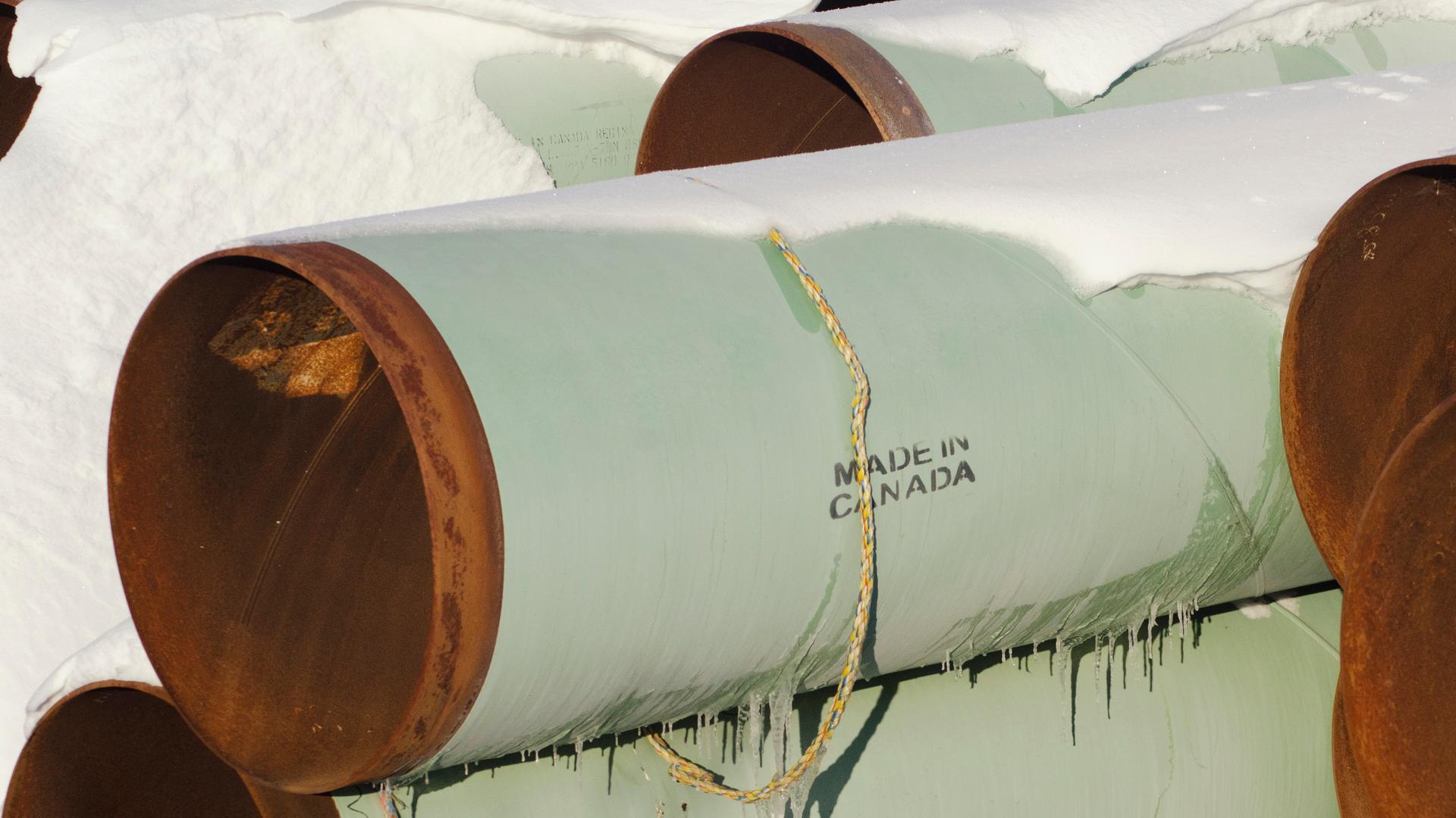 Both outgoing Canadian prime minister Steven Harper and his newly-elected successor Justin Trudeau hope these sections of pipe will eventually get put into place as part of the planned Keystone XL oil pipeline from Alberta to Texas. But politics and econo