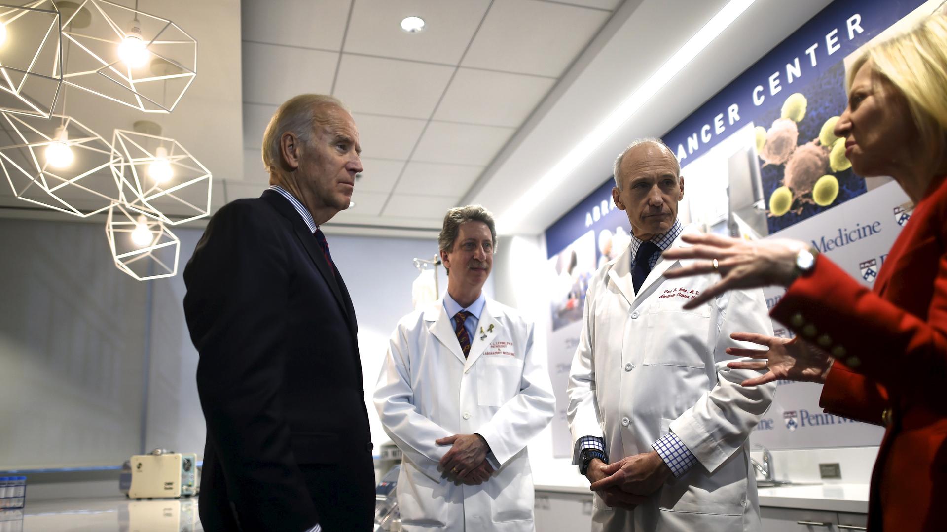 Vice President Joe Biden (L) meets with (C-R) Dr. Bruce Levine, Dr. Carl June, and University of Pennsylvania President Amy Gutmann while touring the University of Pennsylvania, Perelman School of Medicine and Abramson Cancer Center. During the State of t
