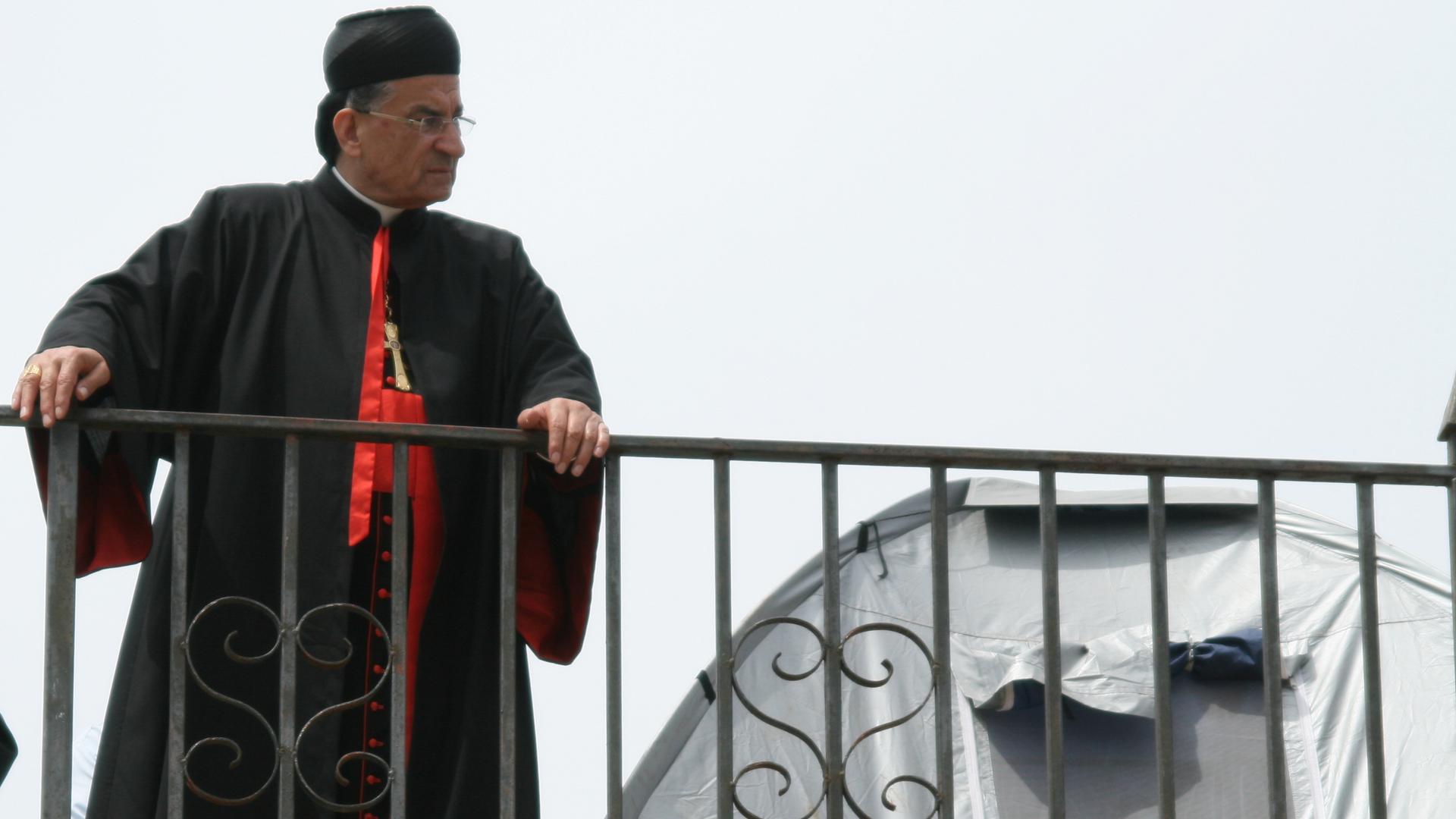 Lebanese Maronite Cardinal Bechara Rai looks over the ruins of Kfar Biram from the top of the village's church in northern Israel. Activists have been living in tents on the site for months to pressure Israel to rebuild the destroyed community.