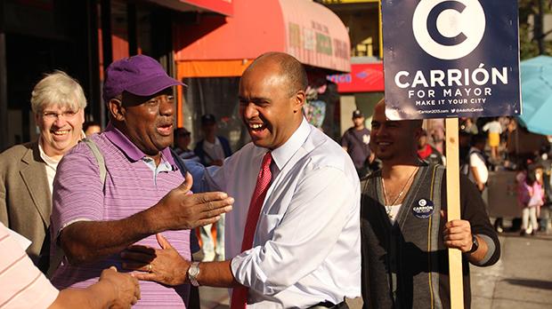 Adolfo Carrión campaigns along 116th Street in “El Barrio” in East Harlem. Carrión, a former Bronx Borough President and member of the Obama administration, is running for New York City mayor on the Independence Party ticket.