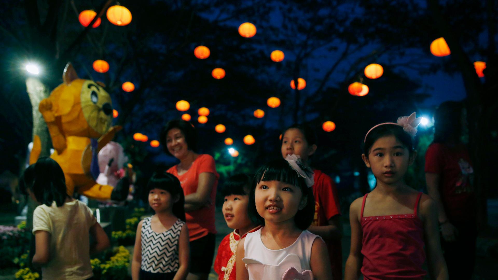 Children look at a light display for Chinese New Year outside Kuala Lumpur.