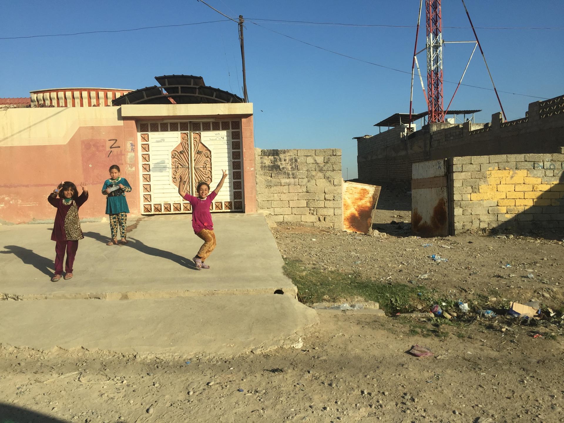 A group of kids play in the Mosul