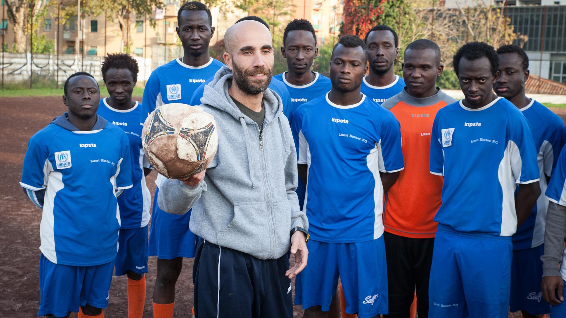 Coach Salvatore Lisciandrello and some of this year's Liberi Nantes players