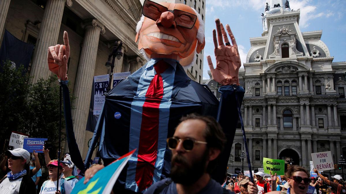 A giant puppet of Bernie Sanders is carried as protesters march against presumptive Democratic presidential nominee Hillary Clinton, ahead of the Democratic National Convention, in Philadelphia.