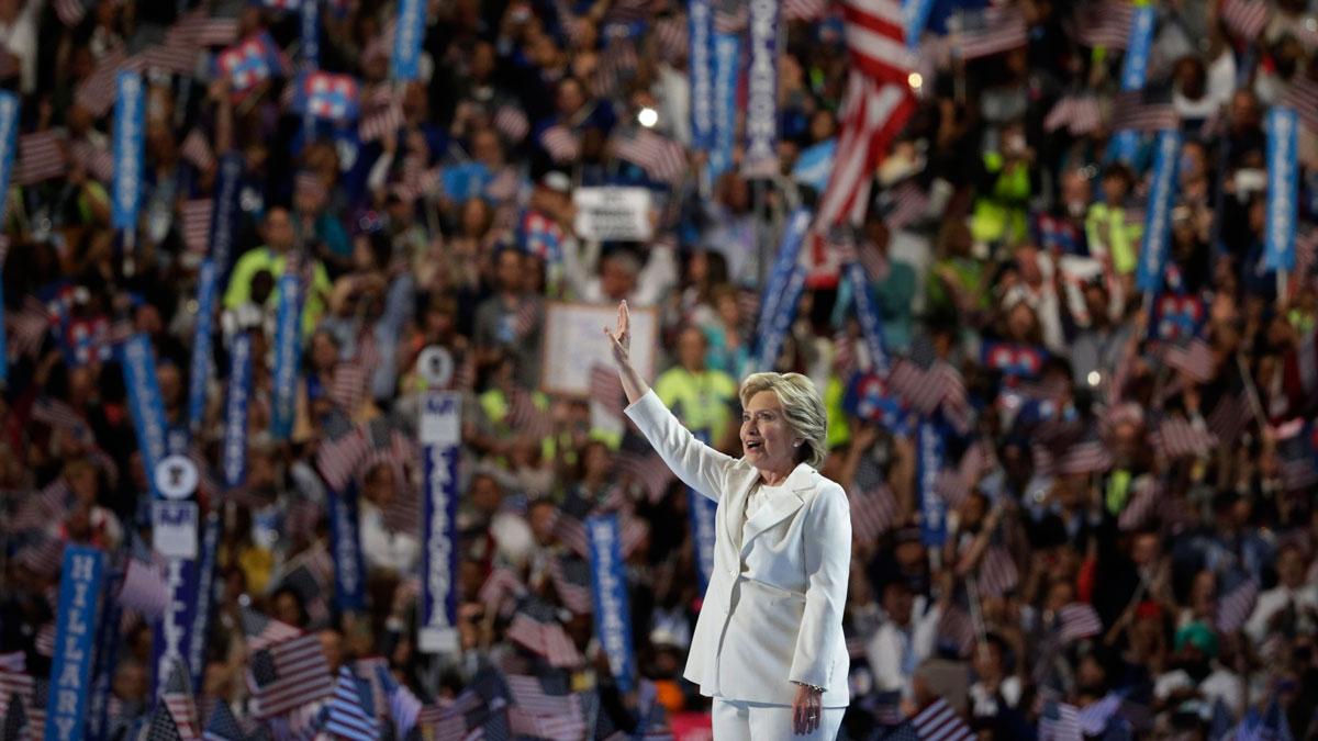 Hillary Clinton waves as she arrives onstage to accept the nomination.