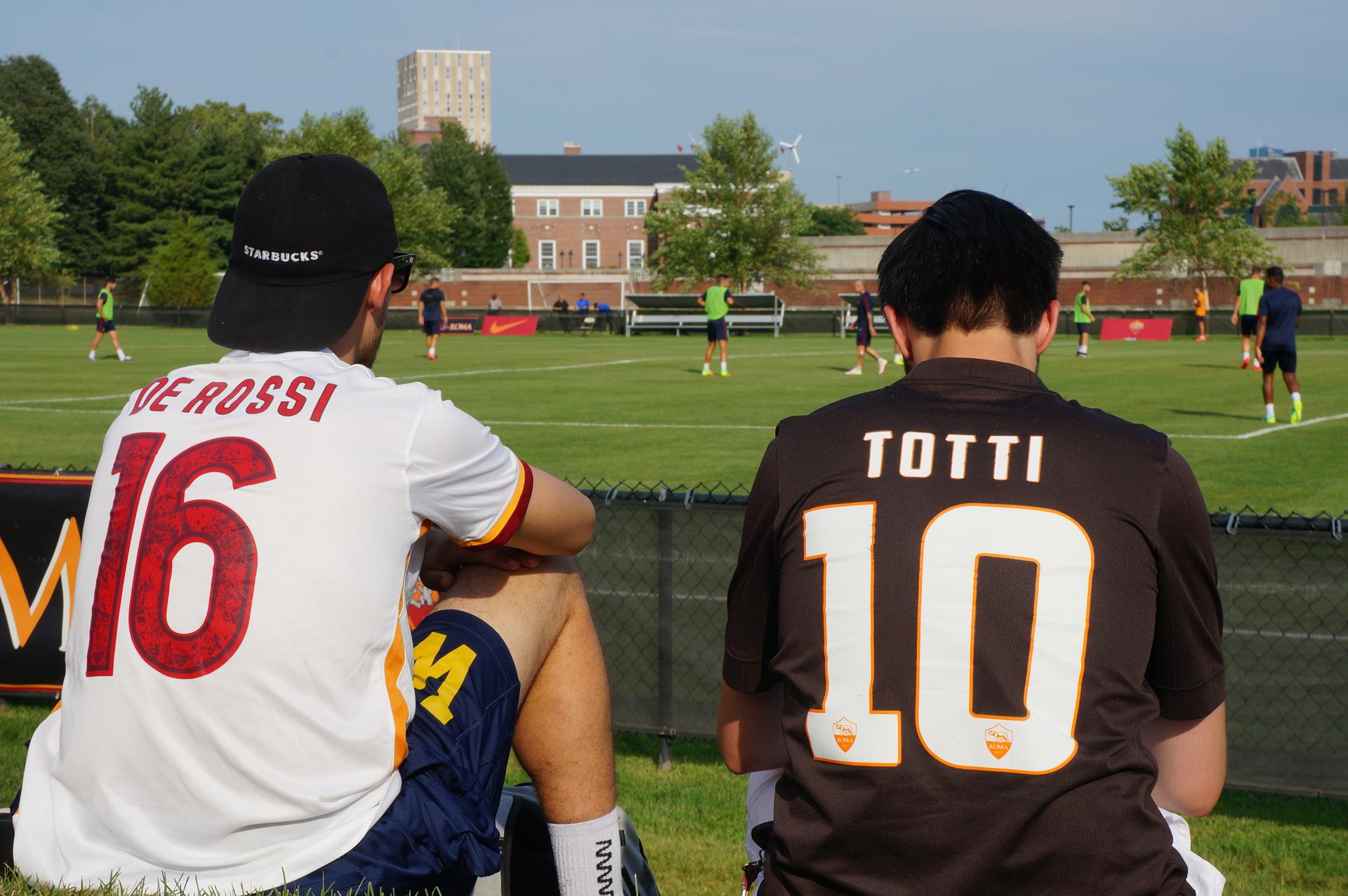 Two fans sporting De Rossi and Totti jerseys watch A.C. Roma train in Boston, Massachusetts July 28, 2016.