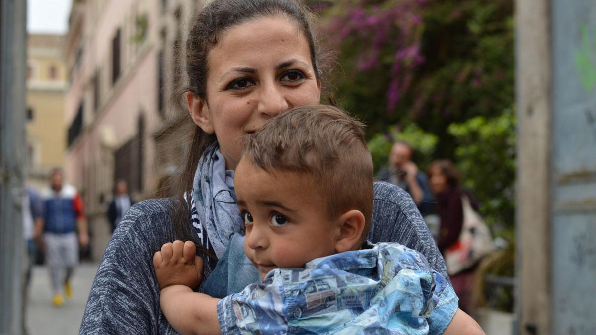 The youngest Syrian refugee aboard the papal plane was 2-year-old Riyad, carried here by his mother Nour.