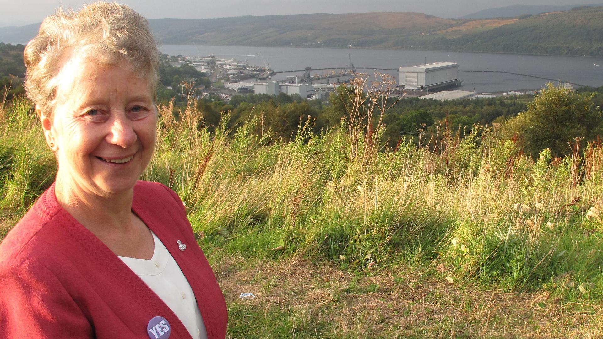 Vivien Dance, a vocal YES campaigner. She's standing in front of Faslane, the military installation that houses the UK's nuclear arsenal and employs some 6,000 people. 