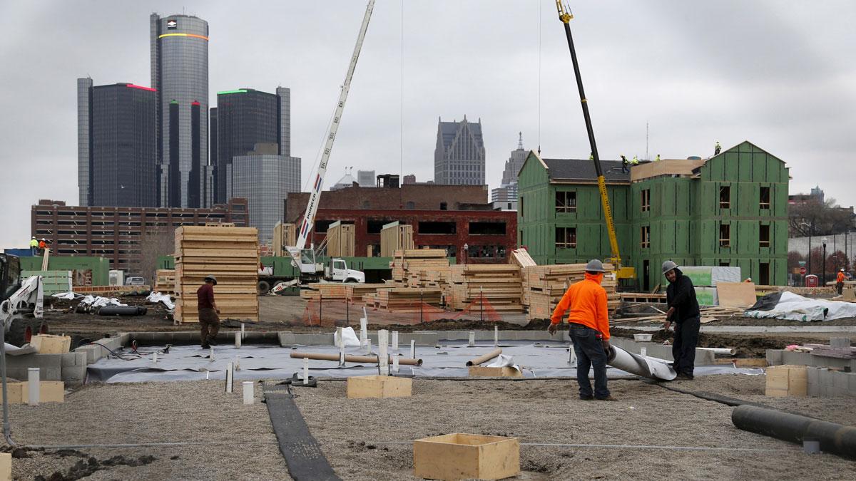 Construction is seen on a new housing development along the riverfront in Detroit, Michigan, December 9, 2015. A year after the city exited the biggest-ever US municipal bankruptcy, a plan to demolish half of its nearly 80,000 blighted or deteriorating st