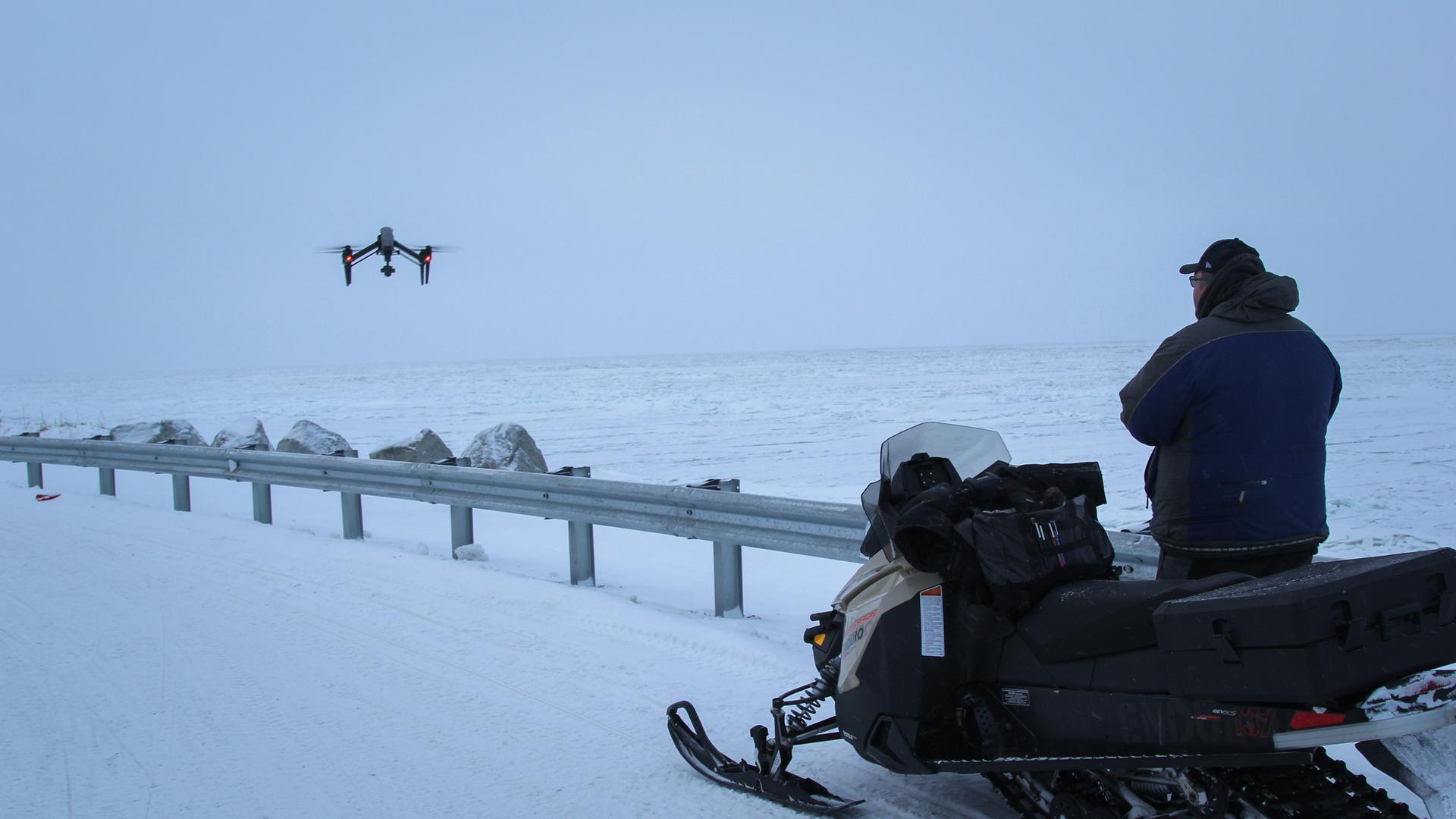 Subsistence hunter Dennis Davis sends his drone out over the ice on the Chukchi Sea in Shishmaref in far-western Alaska. Warming winters have made the sea ice here more dangerous to navigate in search of seals and walruses, but drones can help map the bes