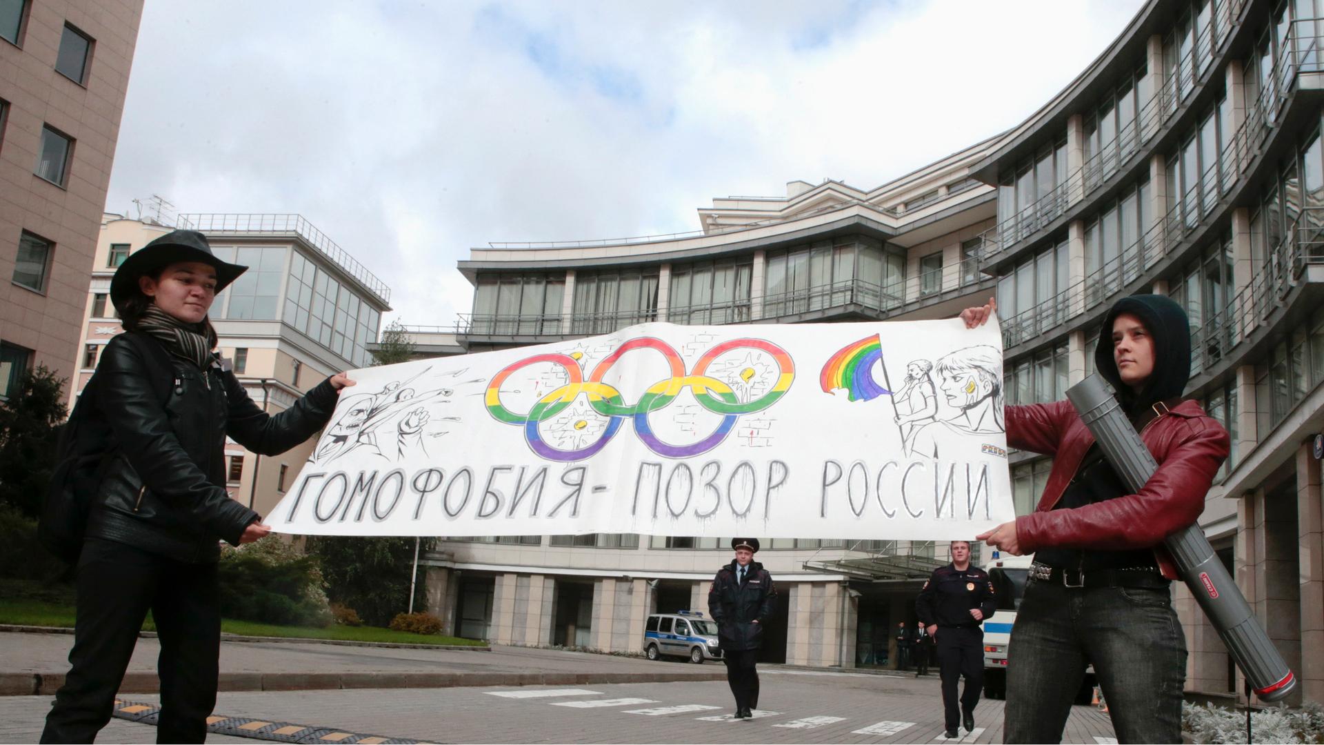 Gay rights activists in Moscow held a banner that reads "Homophobia is the shame of Russia," as they protested in front of the Sochi 2014 organizing committee building in Moscow on September 25, 2013.