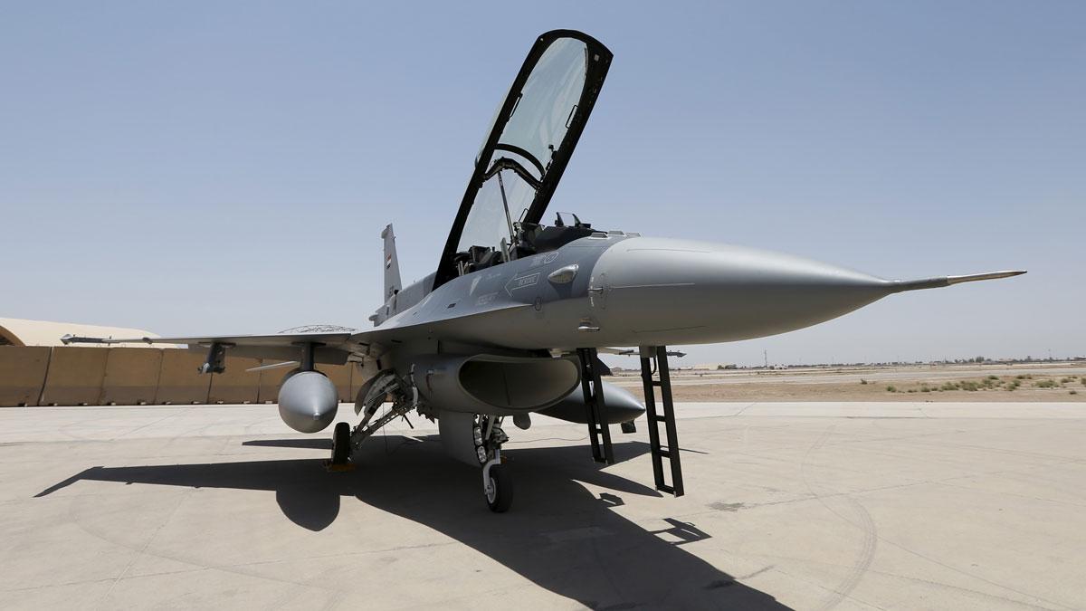 A US F-16 fighter jet at the tarmac a military base in Balad, Iraq. Temperatures in Iraq have reached 140 degrees Fahrenheit in the past year.