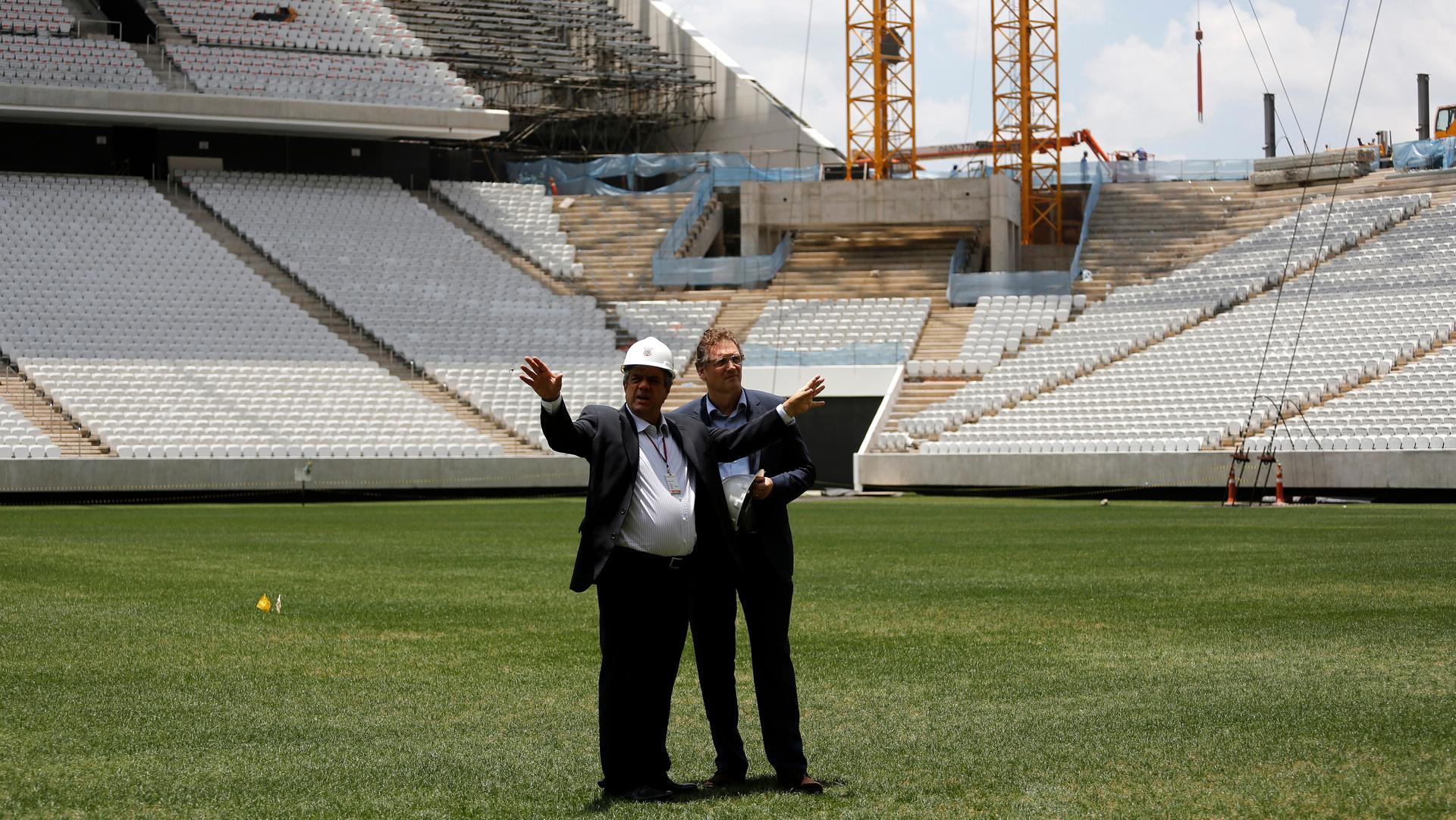 FIFA official and engineer inspect stadium in Sao Paulo, Brazil