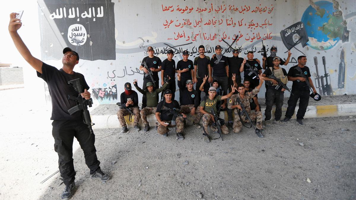 Iraqi counterterrorism forces pose for a picture in Fallujah, Iraq.