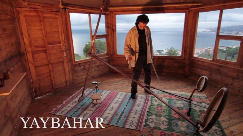 Görkem Şen plays the Yaybahar with the Marmara Sea in the background. He hopes his instrument will soon be as common as a violin or cello.