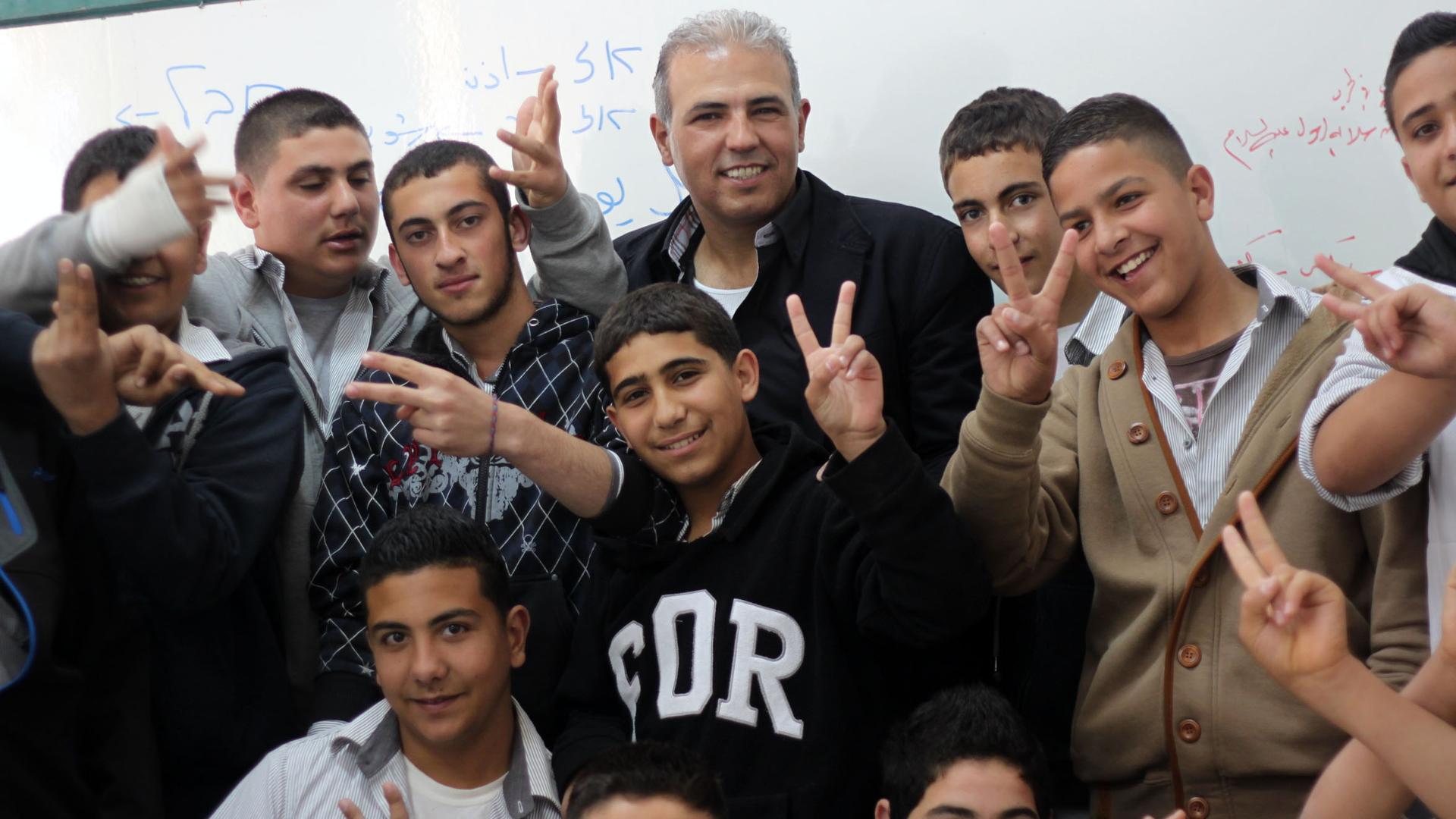 Esmat Mansour, convicted by Israel for murder and jailed for 22 years, with his ninth grade Hebrew students.