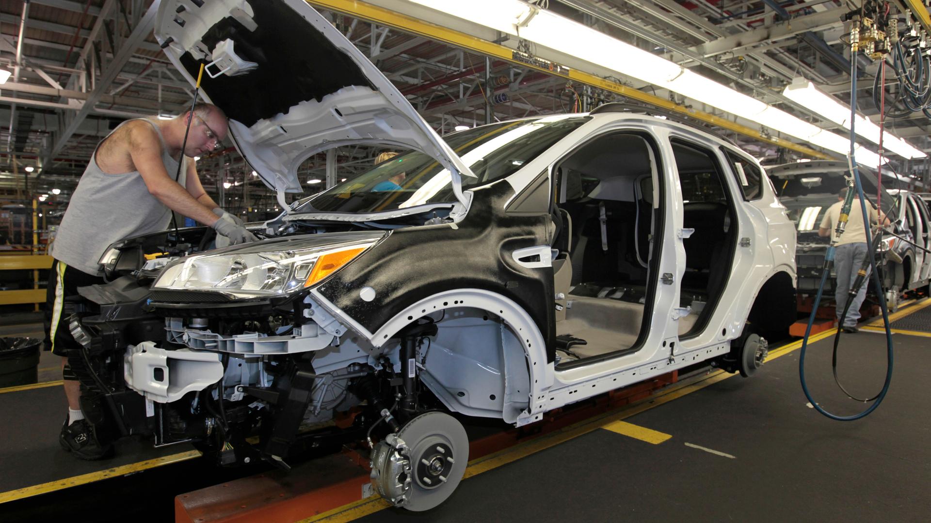American workers assemble a Ford Escape on the production line in Louisville, Kentucky.