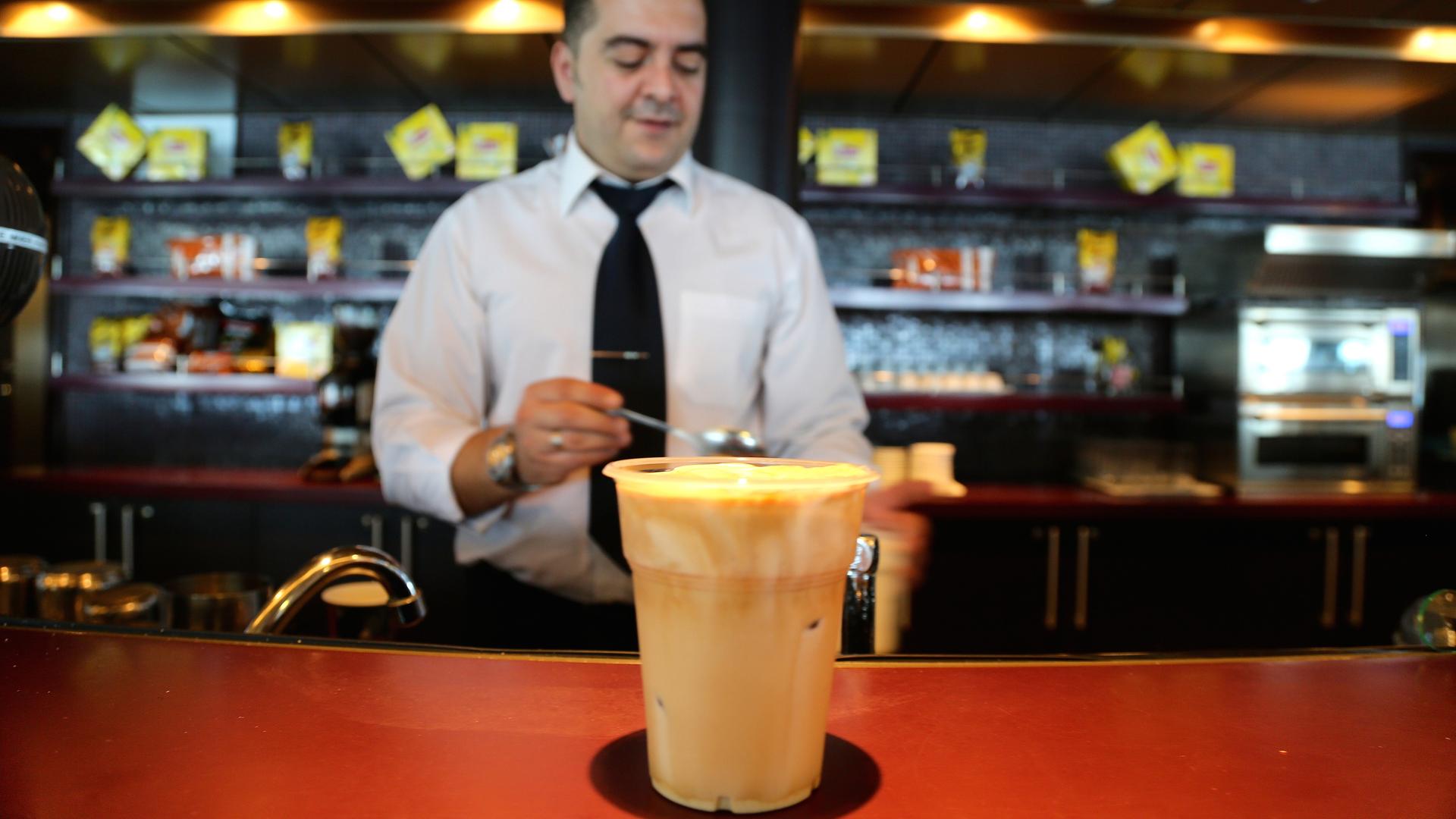 George makes about a hundred frappuccinos a day for the guests on board a Greek ferry docked in Tobruk, Libya.
