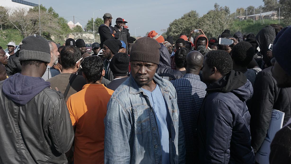 A group of African migrants, including English-speaking Cameroonians, protests against the deportation of asylum-seekers on the Greek island of Lesbos.