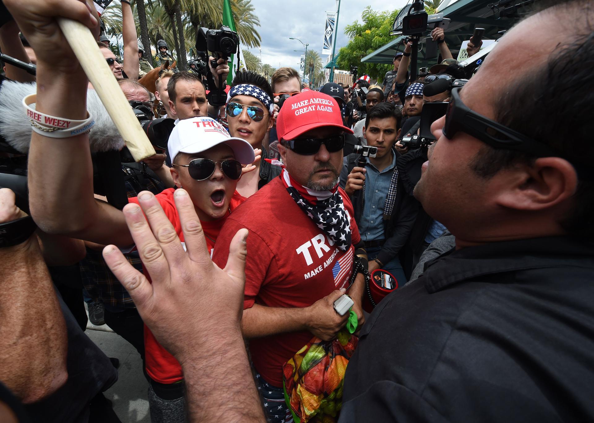 Anti-Trump protesters (R) clash with Donald Trump supporters (L) outside the Anaheim Convention Center during a rally for Republican presidential candidate Donald Trump on May 25, 2016 in Anaheim, California.