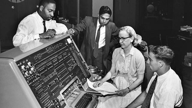 Grace Hopper sits behind the UNIVAC (universal automatic computer) keyboard in the early '60s. As a mathematician and rear admiral in the US Navy, she helped design the UNIVAC I and many other related systems.