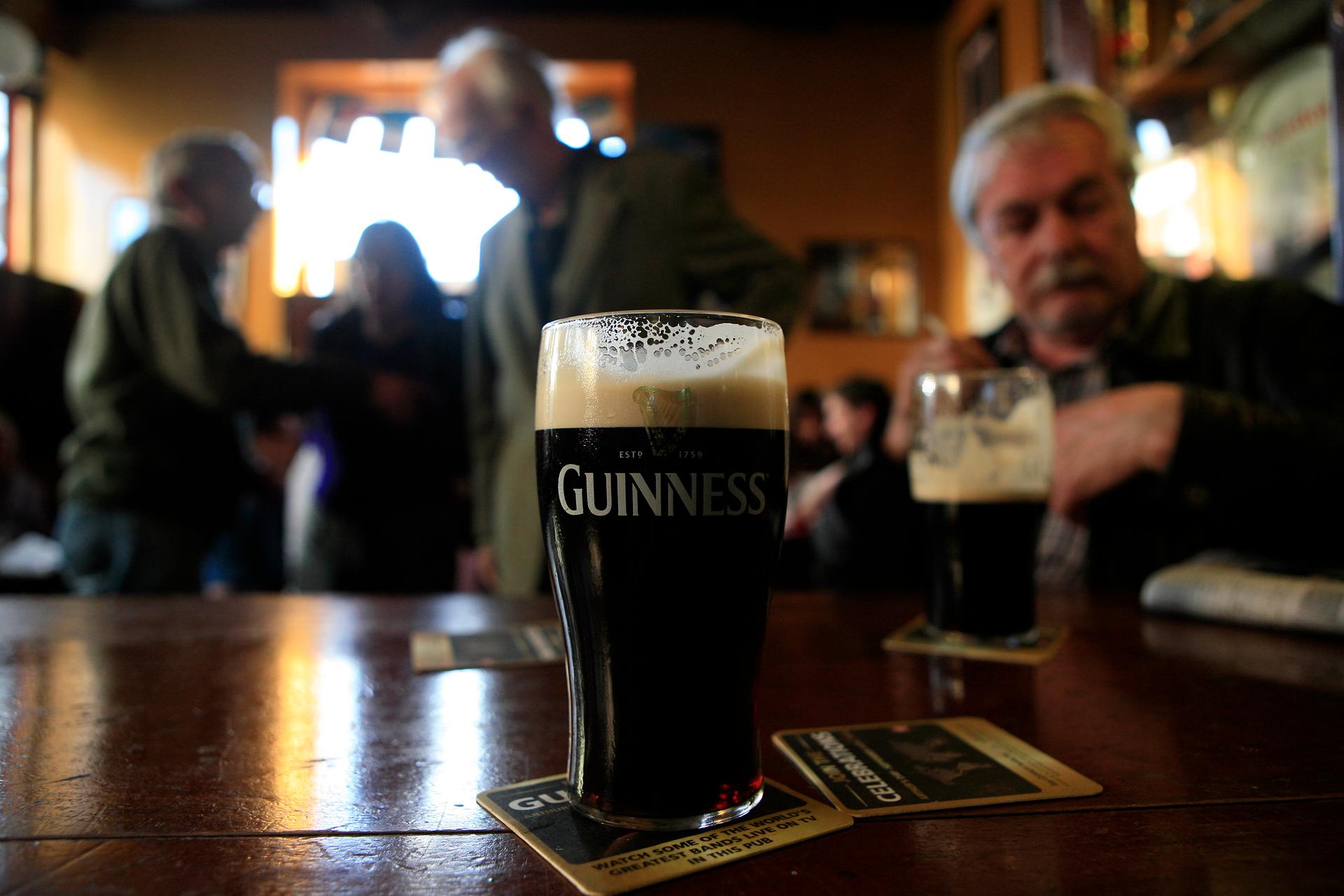 Customers enjoy a pint of stout during Arthur's Day in Dublin.