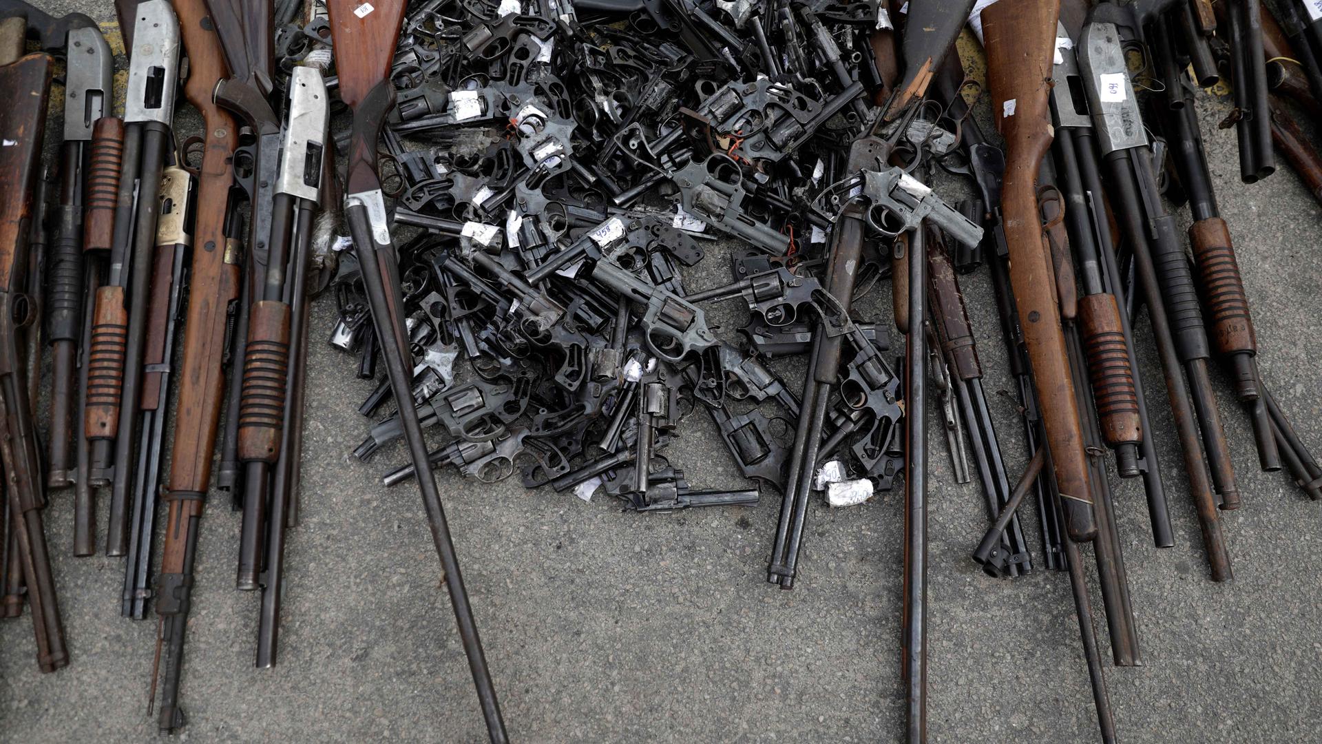 Some of about 4,000 guns seized by Brazil's Federal Police or delivered by residents during a public disarmament campaign, are pictured before being destroyed in Rio de Janeiro on June 2, 2017.