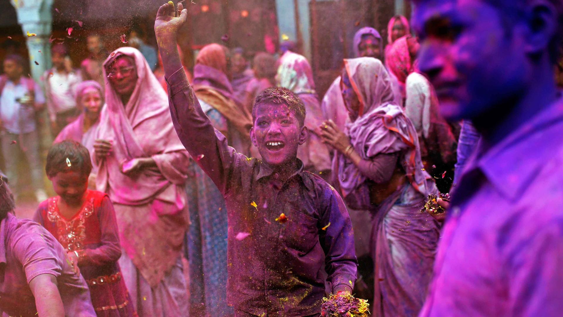 People take part in the Holi celebrations in the northern Indian state of Uttar Pradesh.